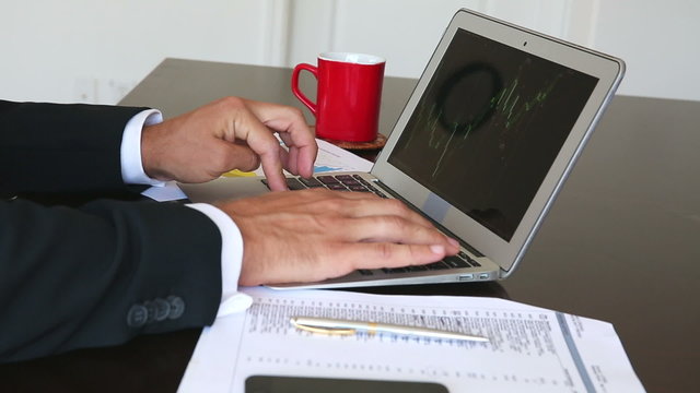 Businessman working on laptop at home