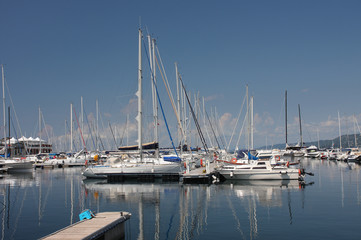 Fototapeta na wymiar Motor boats and sailboats in harbor in Trieste, Italy