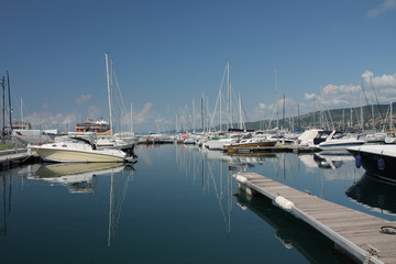 Fototapeta premium Motor boats and sailboats in harbor in Trieste, Italy