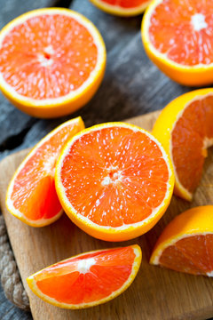 red oranges on wooden surface