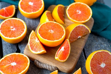 red oranges on wooden surface