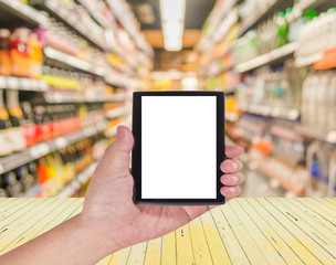 blurred image of shopping mall and people for background usage.