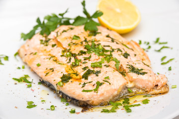 Poached salmon with extra virgin olive oil and parsley 
