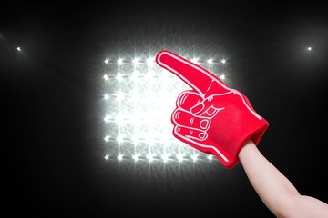 Composite image of red foam hand