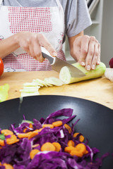 Preparing fresh organic food. Cutting vegetables