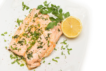 Poached salmon with extra virgin olive oil and parsley 