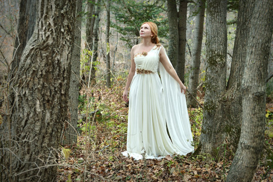 Beautiful Fairy lady wearing white dress in the forest