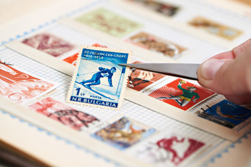 Postage stamp with skier on album