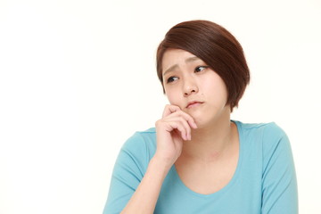 young Japanese woman worries about something