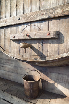 big wooden wine barrel with faucet