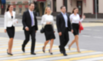 Business People crossing the street, creative abstract blur back