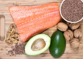 Sources of omega 3 fatty acids: flaxseeds, avocado, salmon and walnuts - 94712892