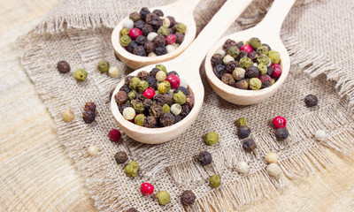 Color pepper on a wooden background.