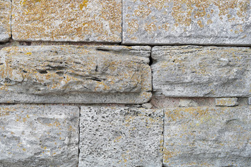 Laying of stone blocks of gray mold