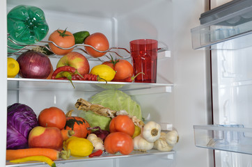 Fruits, vegetables and water in refrigerator
