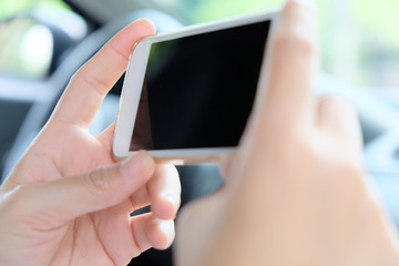 Woman Sitting in the Car and Using Smart Phone