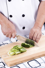 Chef cutting lettuce
