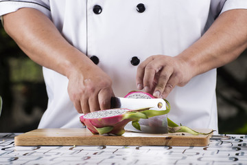 Chef cutting dragon fruit