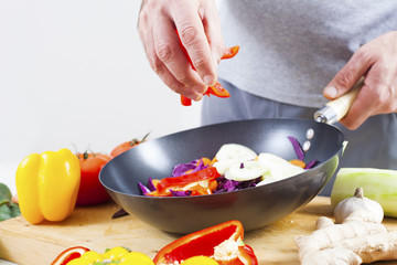 Preparing fresh organic food. Cutting vegetables