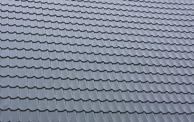 Part of a tiled roof of metal.