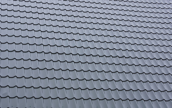 Part of a tiled roof of metal.