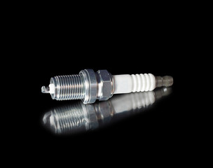 spark plug on black background
