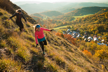 two young women running in the nature in the morning