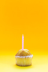 Delicious birthday cupcake on table