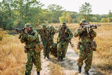 Group of soldiers special forces during the raid in the forest