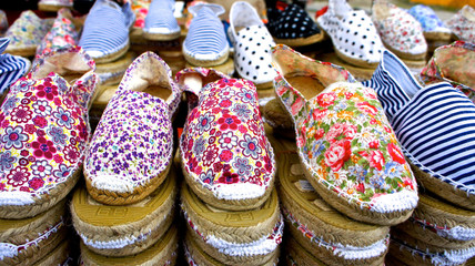 Artisan handmade shoes at market stall