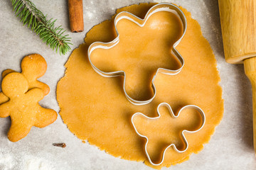 Gingerbread cookie dough and christmas cookie cutters. Baking holiday cookies