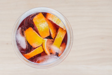 Sangria wine in a glass with ice and lemon slices