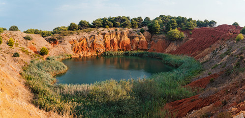 Bauxite Mine with Lake at Otranto. Apulia, Italy. Panoramic image