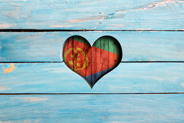 Love Eritrea. Heart and flag on a blue wooden board