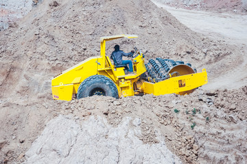 industrial machinery at working construction building site worki