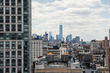 New York City Manhattan skyline with cloudy sky.