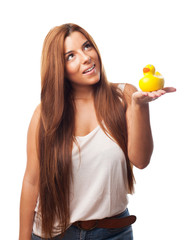 woman smiling holding a duck toy