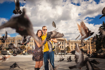 Couple in park with doves