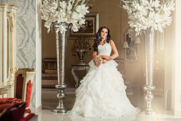 Bride in white wedding dress in luxury place