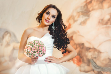 Bride with beauty eyes in white wedding dress