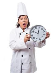 portrait of a mature cook woman with worried gesture on a white background