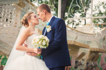 Bride and groom on wedding in the park