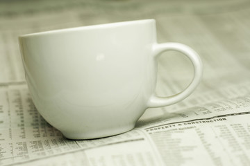 cup of coffee and the newspaper
