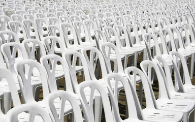 White plastic chairs in celebration and outdoor event