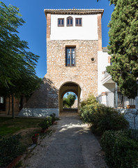 Fototapeta na wymiar Warm courtyard through archway in Spain