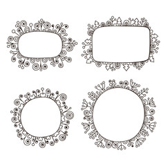 Hand drawn doodle frames with floral ornament. Set of frames wits flowers, berry, hearts, spruce and swirls. Vector black frames, isolated.