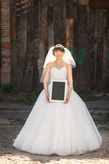 Fototapeta premium Bride with blank placard
