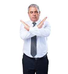 mature man doing a cross with arms