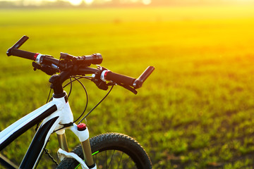 Obraz na płótnie Canvas Beautiful close up scene of bicycle at sunset,