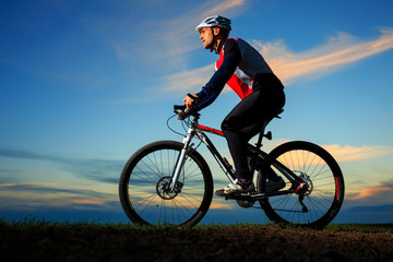 Obraz na płótnie Canvas Cyclist Riding the Bike